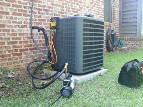 AC maintenance tools on an AC in Springfield, MO